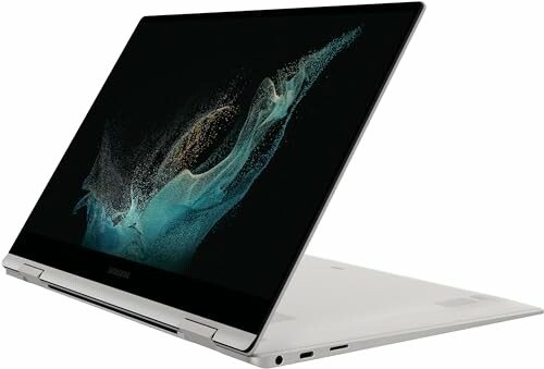 Samsung laptop in open position with abstract screen design