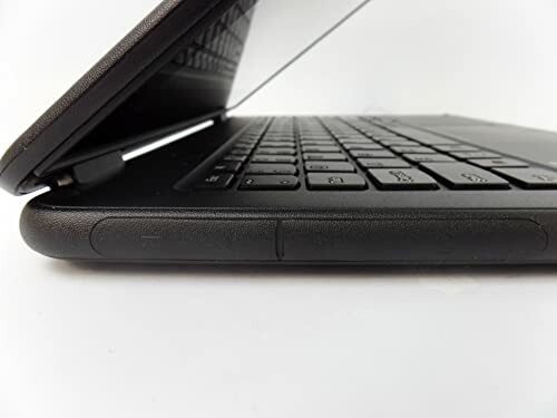 Side view of a partially closed laptop showing keyboard and hinge.